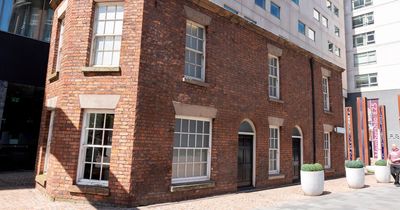 Historic canal cottages outside city hotel thousands pass everyday
