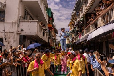 AP PHOTOS: Hong Kong's colorful Bun Festival returns after COVID-19 cancellations