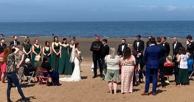 Adorable moment Edinburgh couple tie the knot in front of locals on busy beach