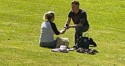 Edinburgh proposal at city centre beauty spot captured in perfectly-timed photo