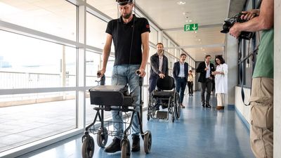 Paralysed man walks with the help of brain implant