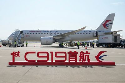 China's 1st domestically made passenger plane completes maiden commercial flight