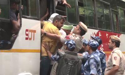 Security personnel detains protesting wrestlers as they proceed towards new Parliament building