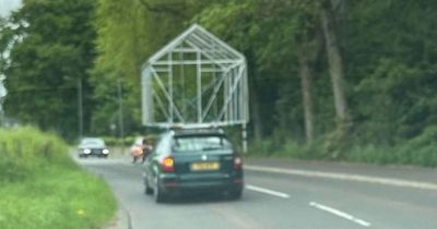 Scottish drivers baffled after spotting car with entire greenhouse on roof
