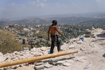 Jewish settlers erect religious school in evacuated West Bank outpost after Israel repeals ban