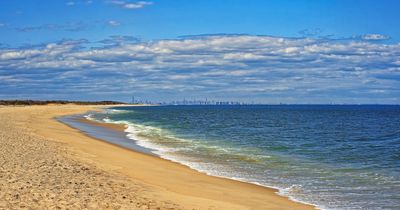 Horrified holidaymakers look on as boy, 15, drowns at beach and five others are rescued