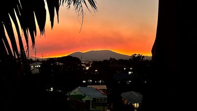 Hazard-reduction burns leave a persistent smoke pall over Brisbane, but do they make sunsets better?