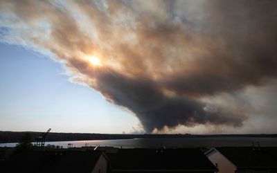 Thousands evacuate as wildfires rage in Halifax, Canada