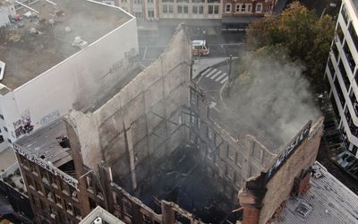 Arson squad and cadaver dogs to comb burnt-out building