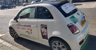 Fuming Edinburgh tenant plasters angry notes on car in city centre street protest