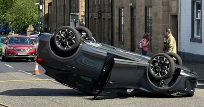 Horrifying moment West Lothian car with 'mother and daughter' flips on busy street