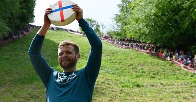 Manchester's big cheese - local man crowned winner of world-famous cheese rolling competition