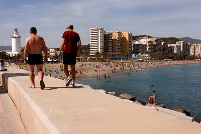 Surprised Spaniards face choice: Ballot box or the beach