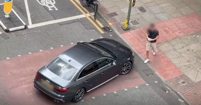 Idiot driver parks in middle of busy road to nip into Tesco