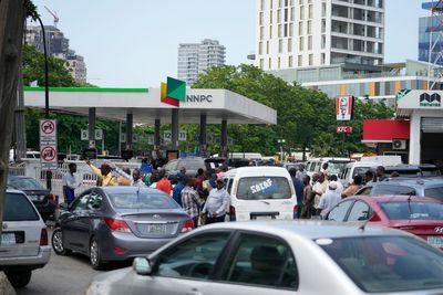 Drivers line up for gasoline across Nigeria after new president scraps fuel subsidy