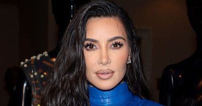 Kim Kardashian looks slimmer than ever as she poses in bra and neon loungewear