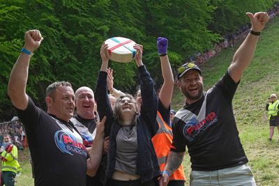 Woman wins famous UK cheese rolling race despite being knocked unconscious