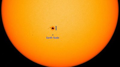 A massive sunspot is currently visible to the unaided eye. Here's how to see it safely before it's gone