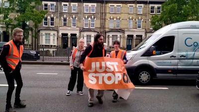 Just Stop Oil hit out as police drag slow marching activists into the road in west London