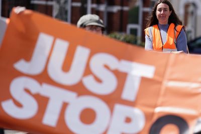 Police officer drags Just Stop Oil protestor off the road during London slow march