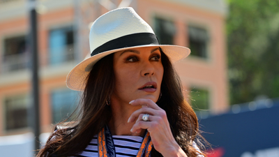 Catherine Zeta-Jones nails casual Monaco style with fun fedora hat, white jeans, and classic Breton top