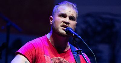 Country star Zach Bryan kicks female fan trying to 'steal his guitar' out of his concert