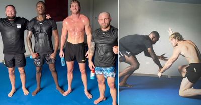 YouTube star Logan Paul grapples with UFC champion Israel Adesanya