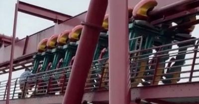 Terrified riders dangle mid-air as roller coaster is stopped so ONE passenger can get off