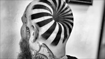 Optical illusion: Man's tattoo looks like he has a hole in his head