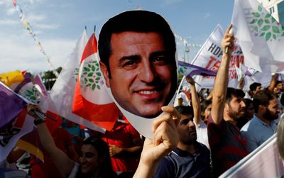 Jailed Kurdish leader quits active politics after party slips in Turkey election