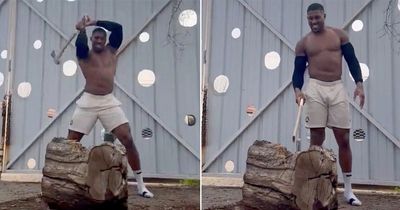 Anthony Joshua channels his inner Rocky as he breaks axe while chopping wood
