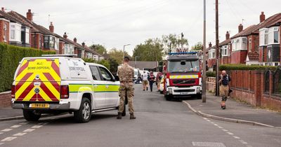 Worried residents 'frantically packing bags' after evacuation as bomb units cordon off roads with major incident declared