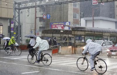 Japan slammed by torrential rain as tropical storm nears