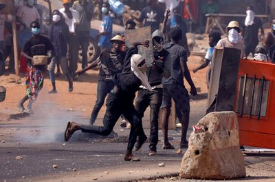 Senegal protesters and police clash again as death toll rises to 10