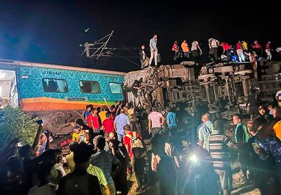 Passenger train derails in India, killing at least 50 and trapping many others