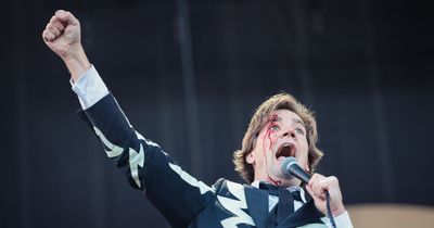 The Hives frontman cuts head open at Arctic Monkeys gig - but carries on singing as blood pours down face