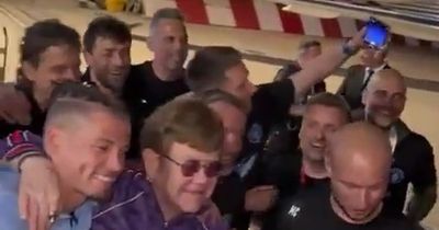 Man City stars greeted off plane by Elton John and break into song after winning FA Cup