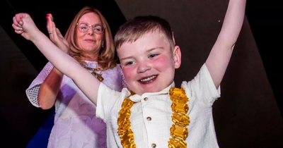 Little hero Dáithí MacGabhann beams as he's awarded freedom of Belfast