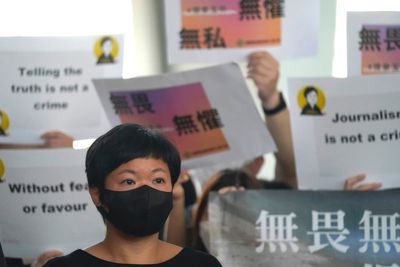 Award-winning Hong Kong journalist wins appeal in rare court ruling upholding media freedom