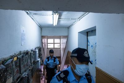 Hong Kong police arrest woman accused of killing 3 young daughters