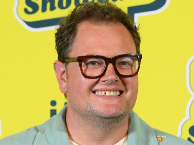 Alan Carr says he got outed to his mother by a Ouija board