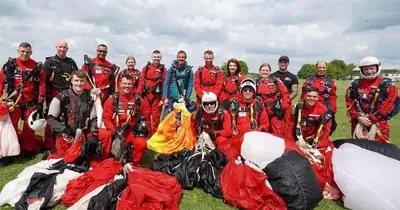 HMP Bristol staff soar through the skies in charity skydive alongside Bear Grylls