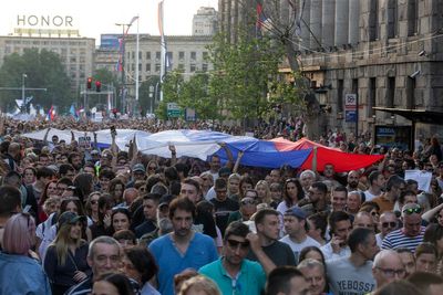 Serbia's president promises early election amid large protests against his populist rule