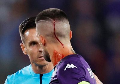 Fiorentina’s Cristiano Biraghi struck by object thrown from West Ham fans