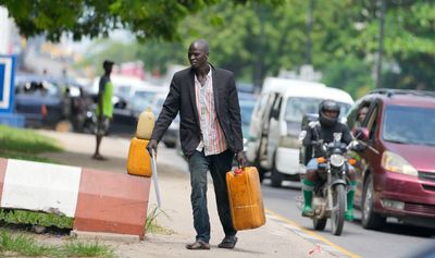 Nigerian leader defends end to fuel subsidy as hardship bites harder