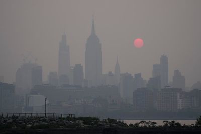 AP PHOTOS: From NYC's skyline to Washington DC's monuments, wildfire haze envelopes familiar sites