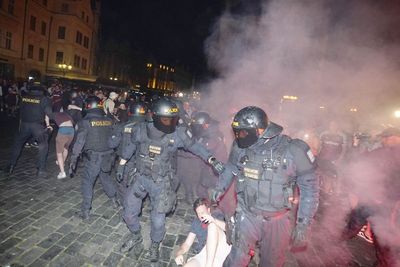 West Ham fans clash with riot police during European final celebrations