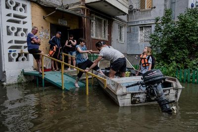 Russia-Ukraine war: Russian troops accused of shelling civilians during flood evacuations – as it happened