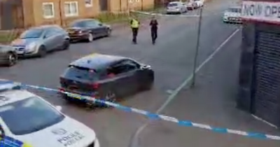 Police lockdown Glasgow street as teenager rushed to hospital after serious assault near chippy