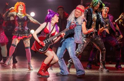 We Will Rock You review – Ben Elton stars as royally ridiculous Queen musical returns